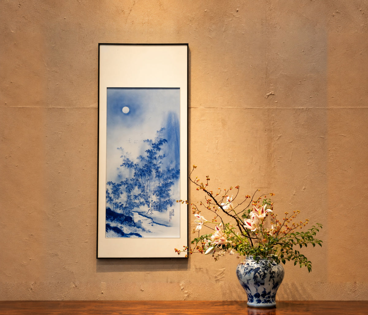 Blue landscape painted on porcelain in a tall dark frame