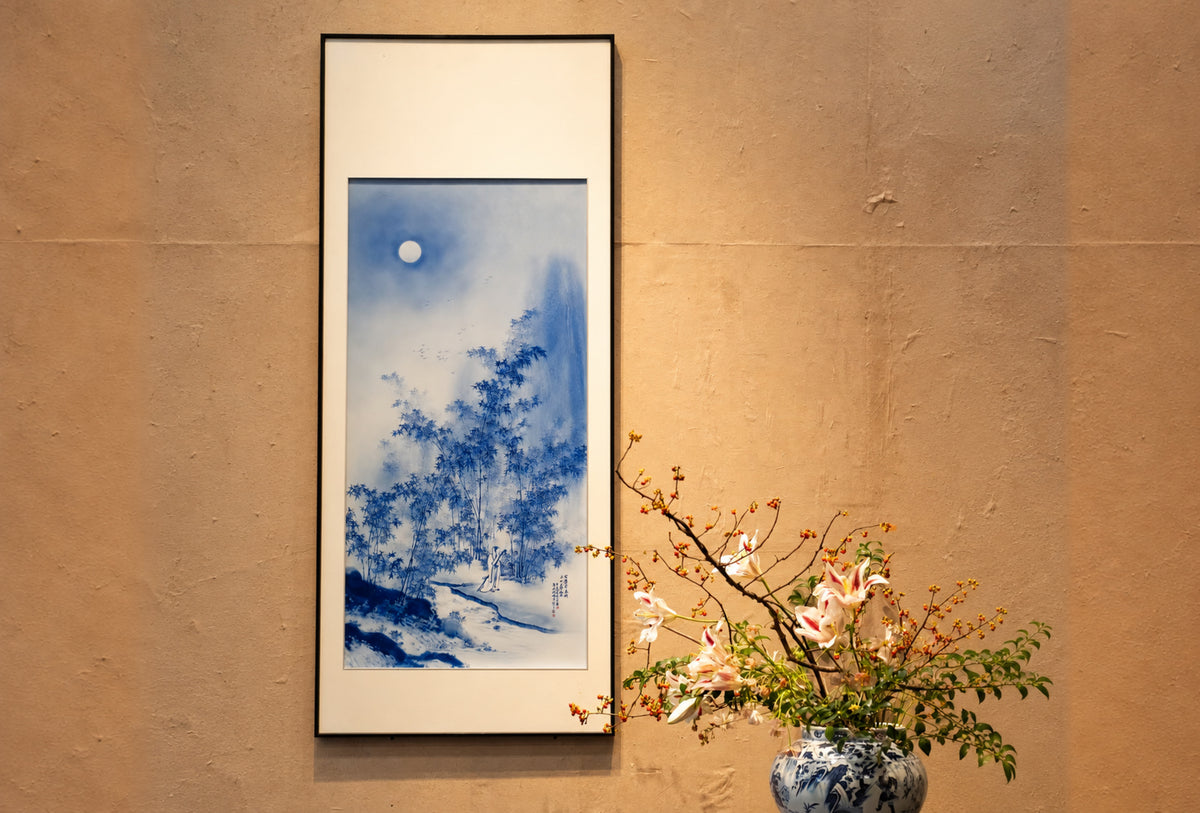 Blue landscape painted on porcelain in a tall dark frame