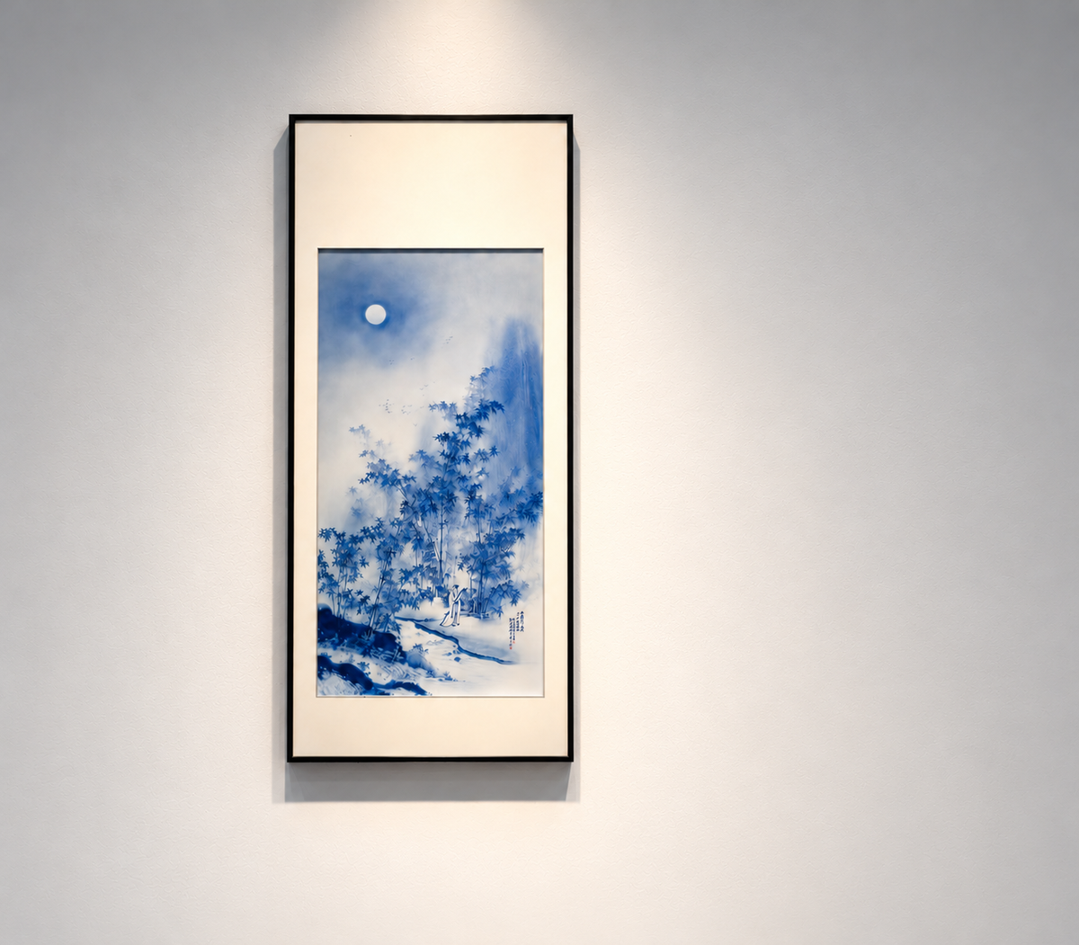 Blue landscape painted on porcelain in a tall dark frame