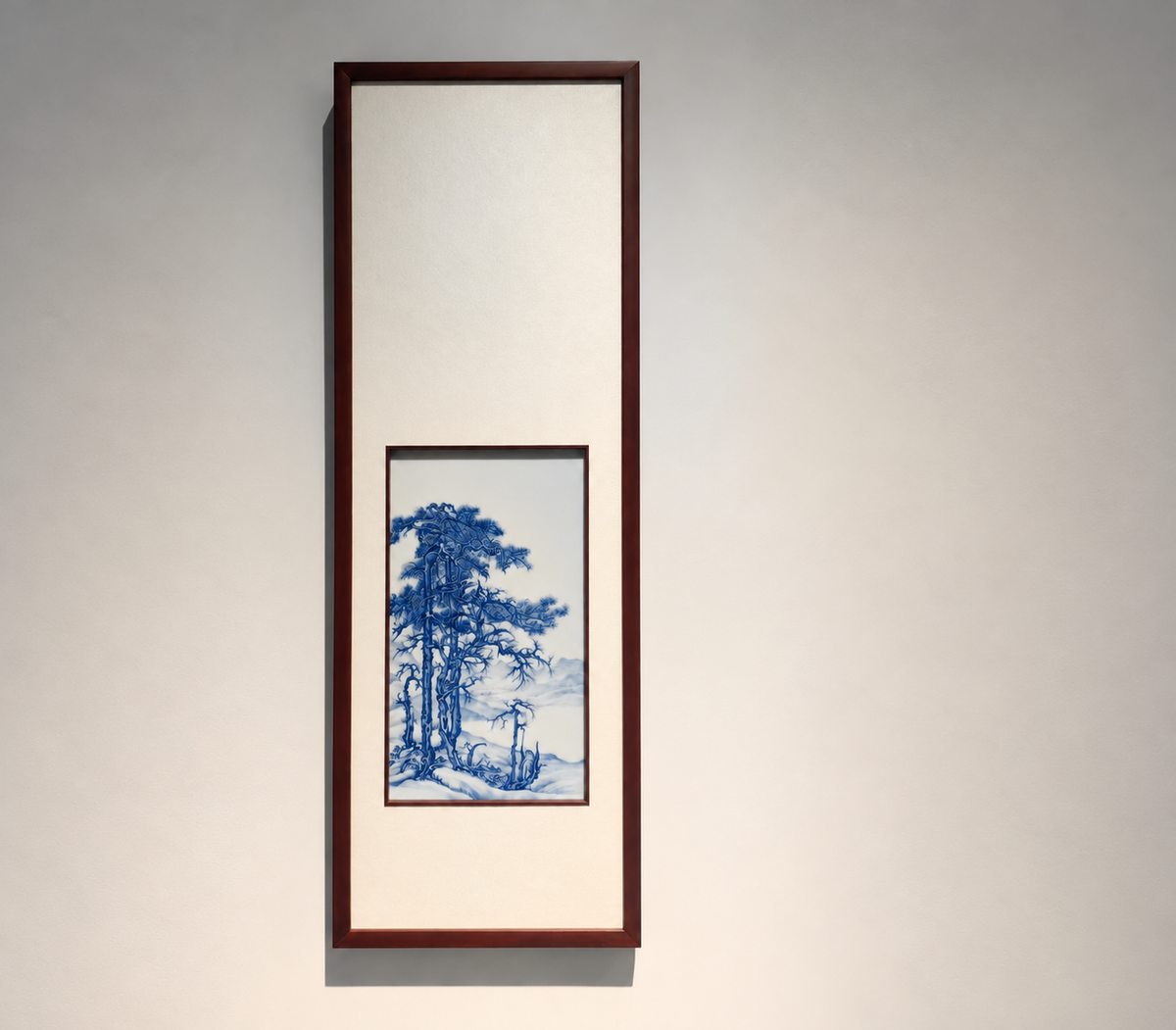 Blue landscape painted on porcelain in a tall dark frame