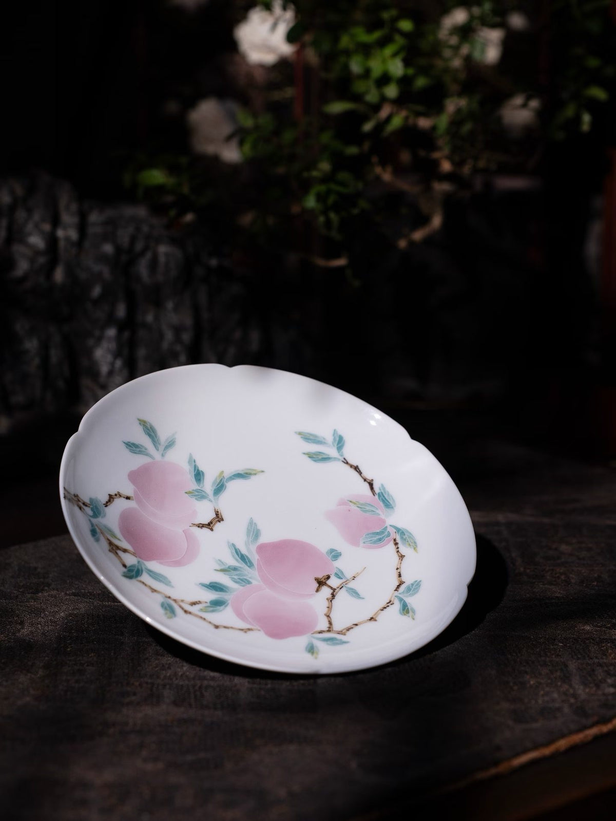 Porcelain plate with painted peaches and leaves